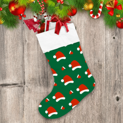 Santa Hat And Christmas Gloves On Green Background Christmas Stocking